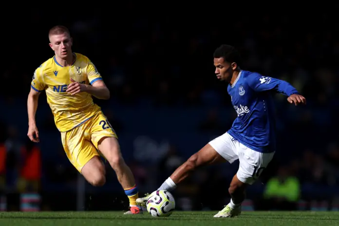 LIVERPOOL, ENGLAND - SEPTEMBER 28: Iliman Ndiaye of Everton controls the ball under pressure from Adam Wharton of Crystal Palace during the Premier League match between Everton FC and Crystal Palace FC at Goodison Park on September 28, 2024 in Liverpool, England.